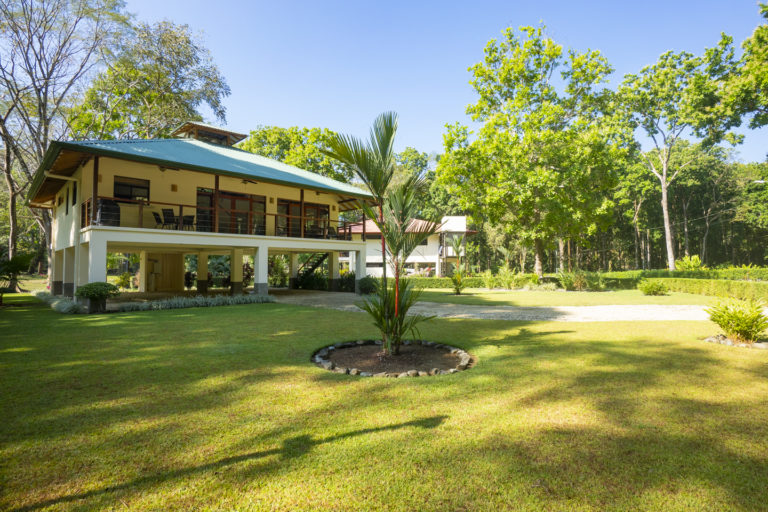 Large front yard area with long private driveway