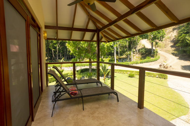 Fully-covered large outdoor patio with lounge chairs