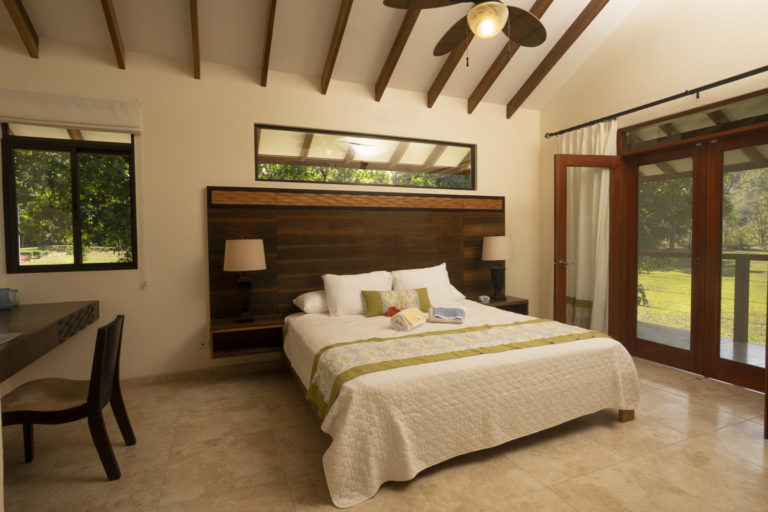 Master Bedroom features a King size bed and double doors with screens to balcony